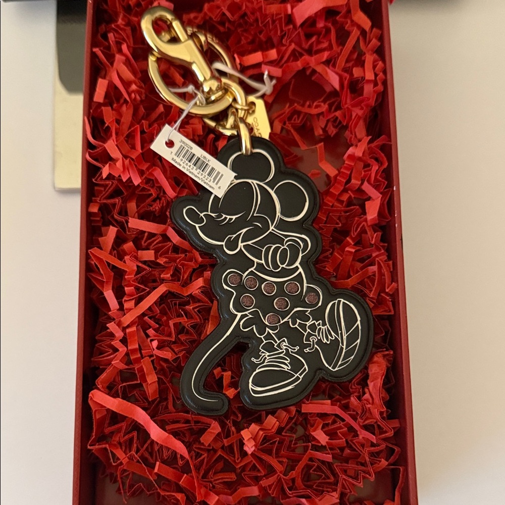 Coach Gold Keychain with Red Accents